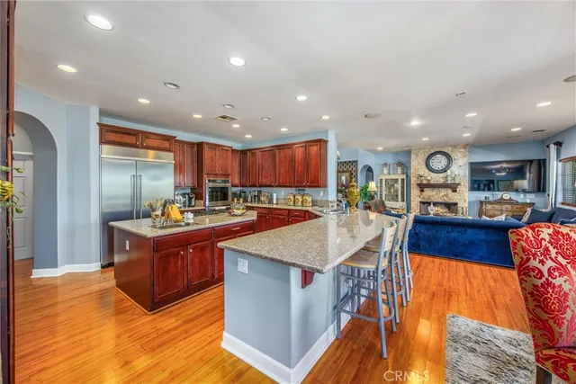a kitchen with stainless steel appliances granite countertop a stove a sink and a cabinets