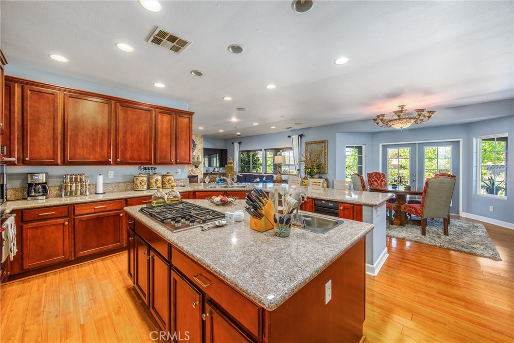 47298 Twin Pines Road Banning, CA 92220 - Photo 12 of 65 a kitchen with stainless steel appliances granite countertop a granite counter tops and a view of living room