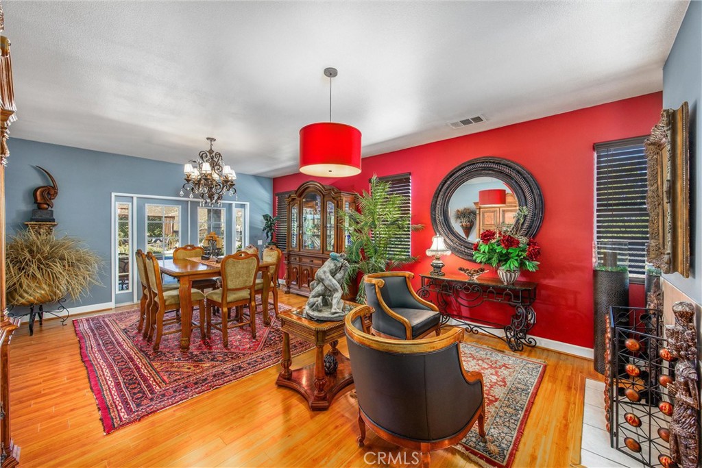 47298 Twin Pines Road Banning, CA 92220 - Photo 18 of 65 a dining room with furniture a chandelier and a rug