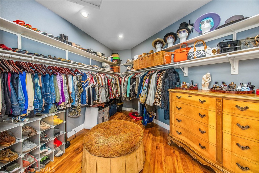47298 Twin Pines Road Banning, CA 92220 - Photo 29 of 65 a view of walk in closet with clothes and shoes