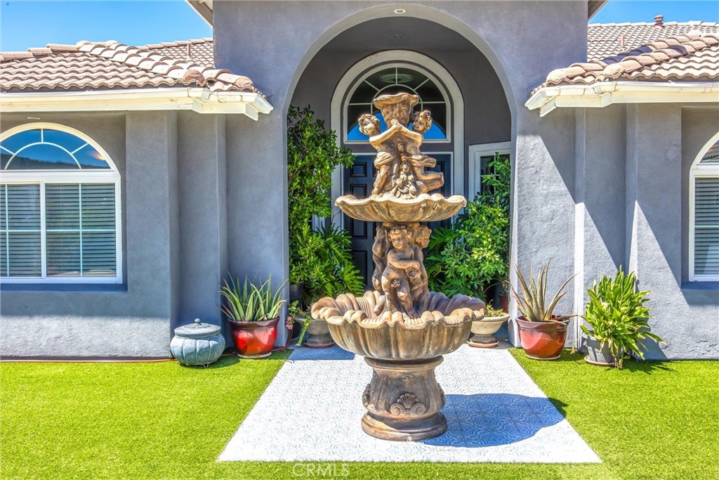 47298 Twin Pines Road Banning, CA 92220 - Photo 36 of 65 a front view of a house with garden