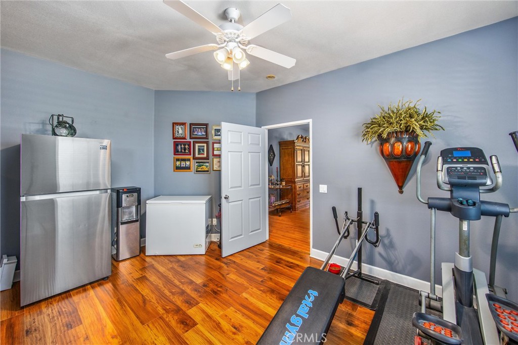 47298 Twin Pines Road Banning, CA 92220 - Photo 38 of 65 a bedroom with a bed and a flat screen tv