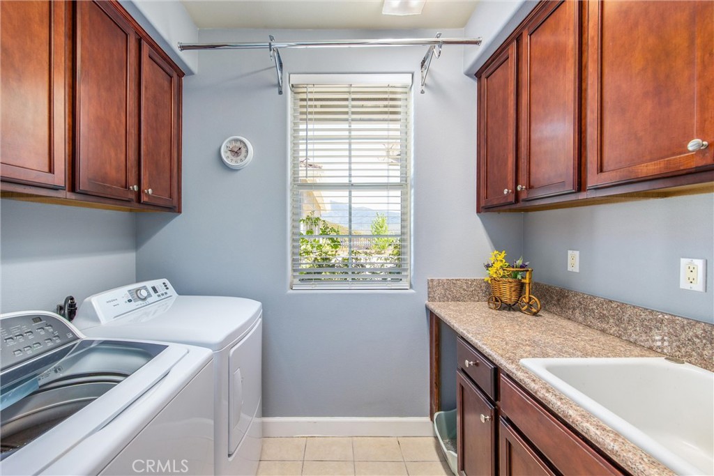 47298 Twin Pines Road Banning, CA 92220 - Photo 46 of 65 Laundry room with storage and sink