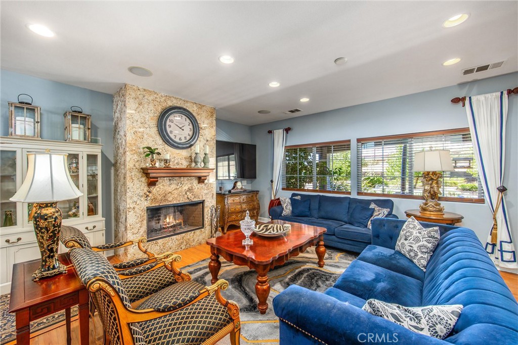 47298 Twin Pines Road Banning, CA 92220 - Photo 7 of 65 a living room with fireplace furniture and a large window