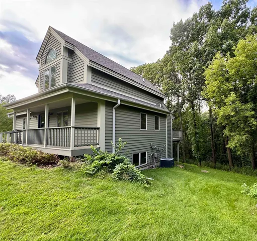 a backyard of a house with lots of green space