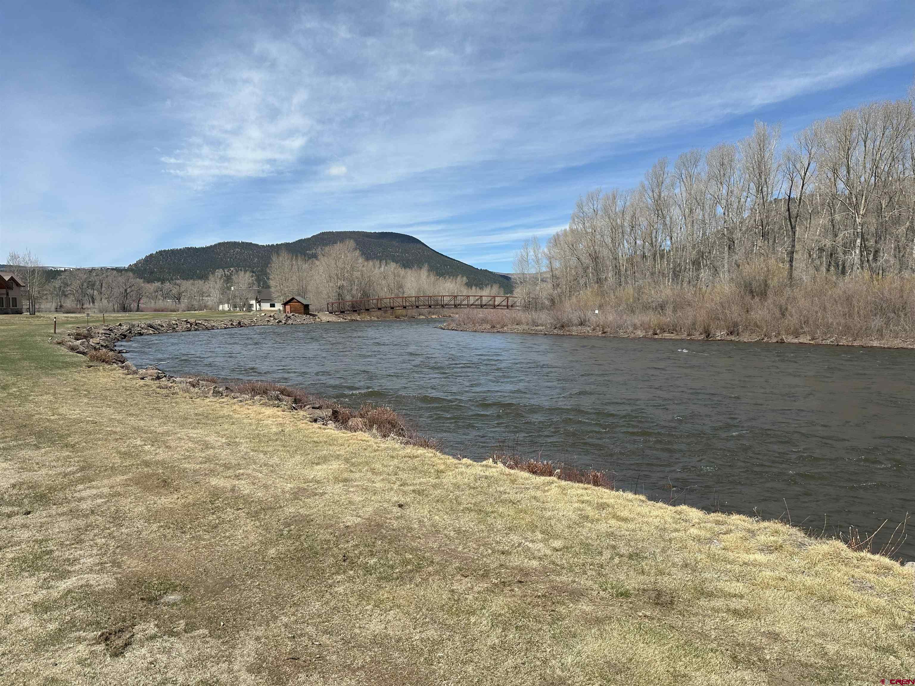 146 West Riverside Court South Fork, CO 81154 - Photo 6 of 12 a view of a lake with mountain in the background