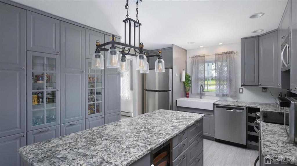 174 South Hill Road Colonia, NJ 07067 - Photo 12 of 31 a kitchen with stainless steel appliances granite countertop a refrigerator and a sink