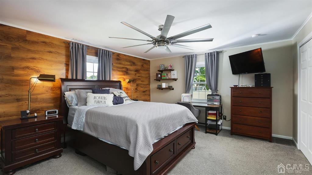 174 South Hill Road Colonia, NJ 07067 - Photo 15 of 31 a bedroom with a bed and a flat screen tv