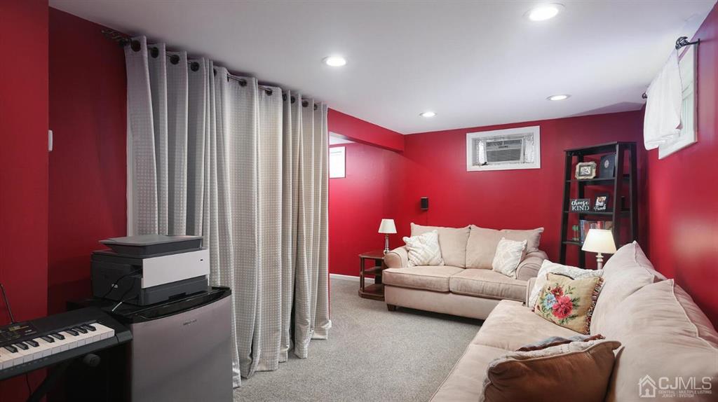 174 South Hill Road Colonia, NJ 07067 - Photo 19 of 31 a living room with furniture a rug and a window