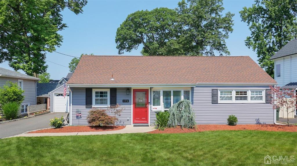 174 South Hill Road Colonia, NJ 07067 - Photo 2 of 31 a house that has a big yard and potted plants in front of a house