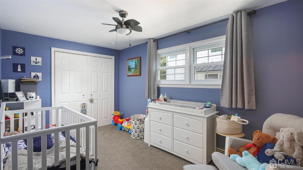 174 South Hill Road Colonia, NJ 07067 - Photo 22 of 31 a bedroom with furniture a bed and a book shelf