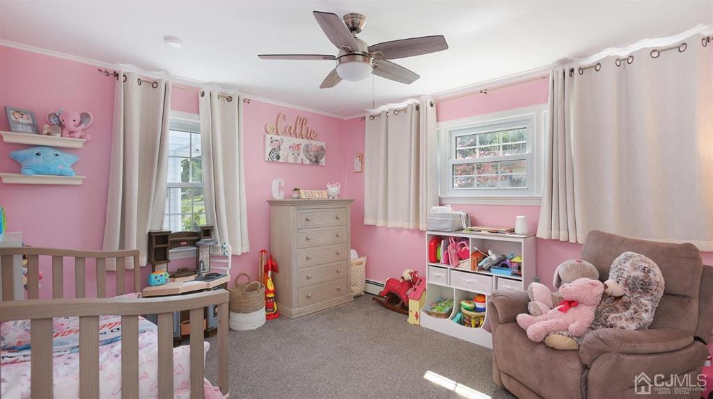 174 South Hill Road Colonia, NJ 07067 - Photo 23 of 31 a bedroom with furniture and a window