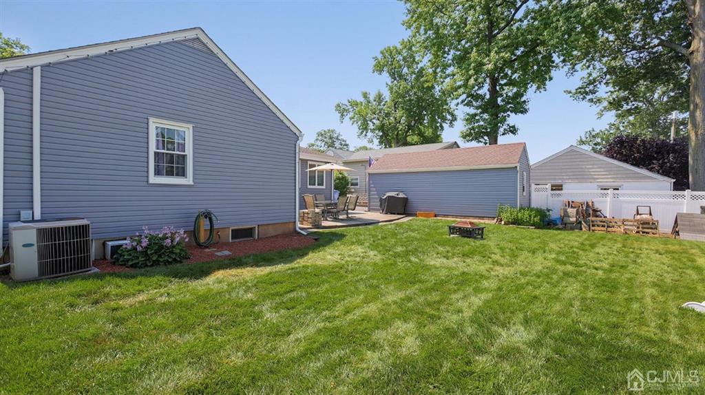 174 South Hill Road Colonia, NJ 07067 - Photo 29 of 31 a backyard of a house with table and chairs