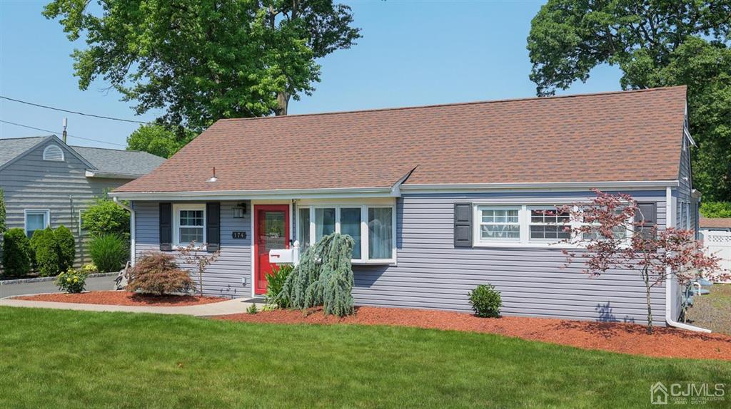 174 South Hill Road Colonia, NJ 07067 - Photo 3 of 31 a front view of a house with a garden and porch