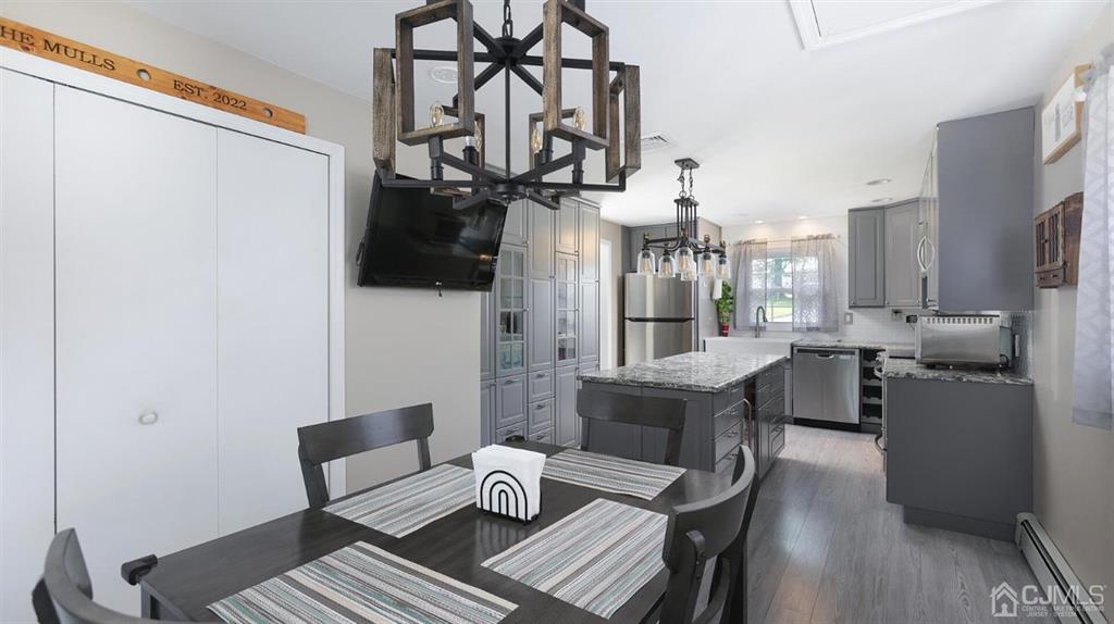 174 South Hill Road Colonia, NJ 07067 - Photo 10 of 31 a dining room with furniture and wooden floor