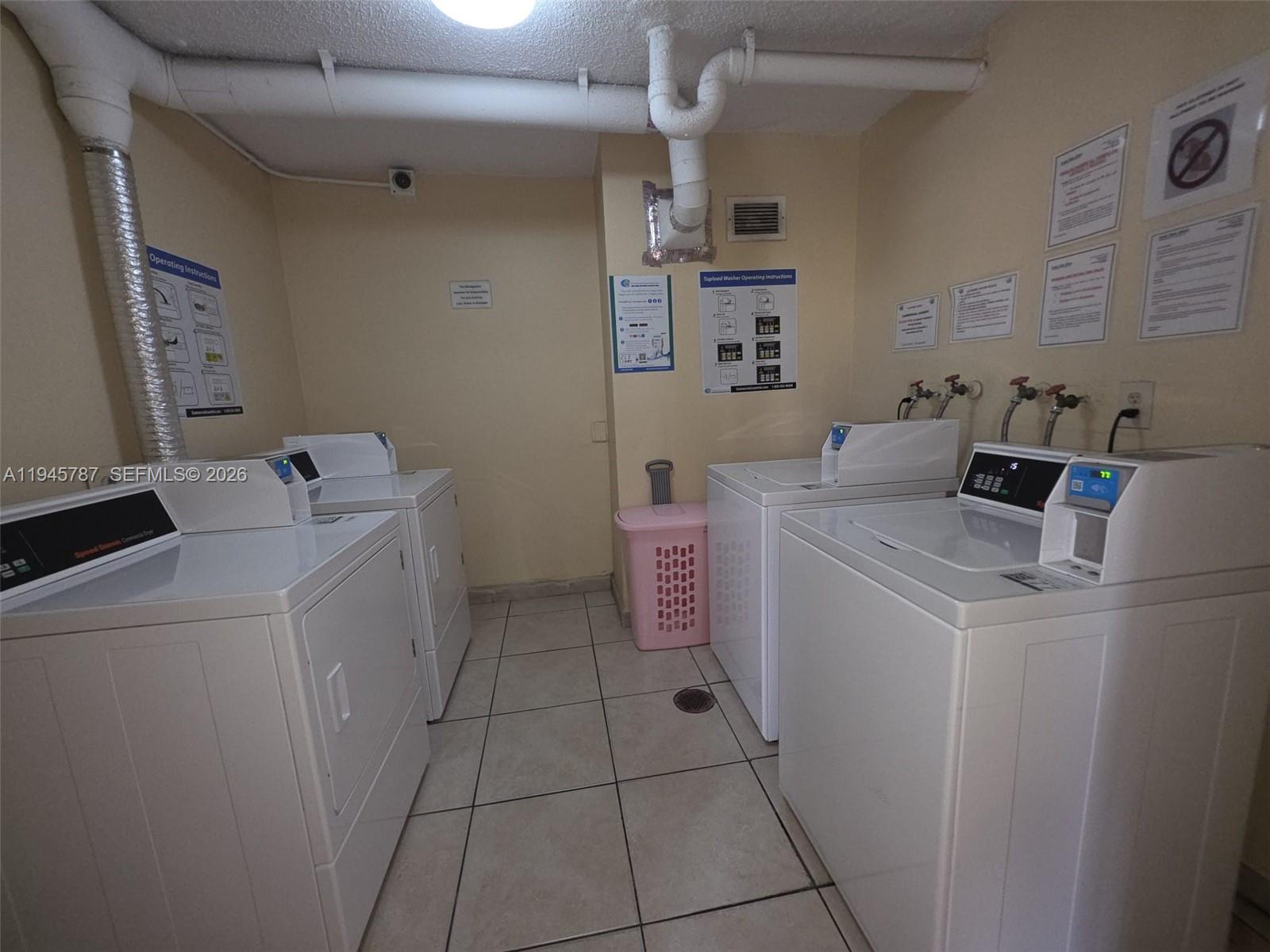 6970 Northwest 186th Street, Unit 3307 Hialeah, FL 33015 - Photo 15 of 21 a utility room with dryer and washer