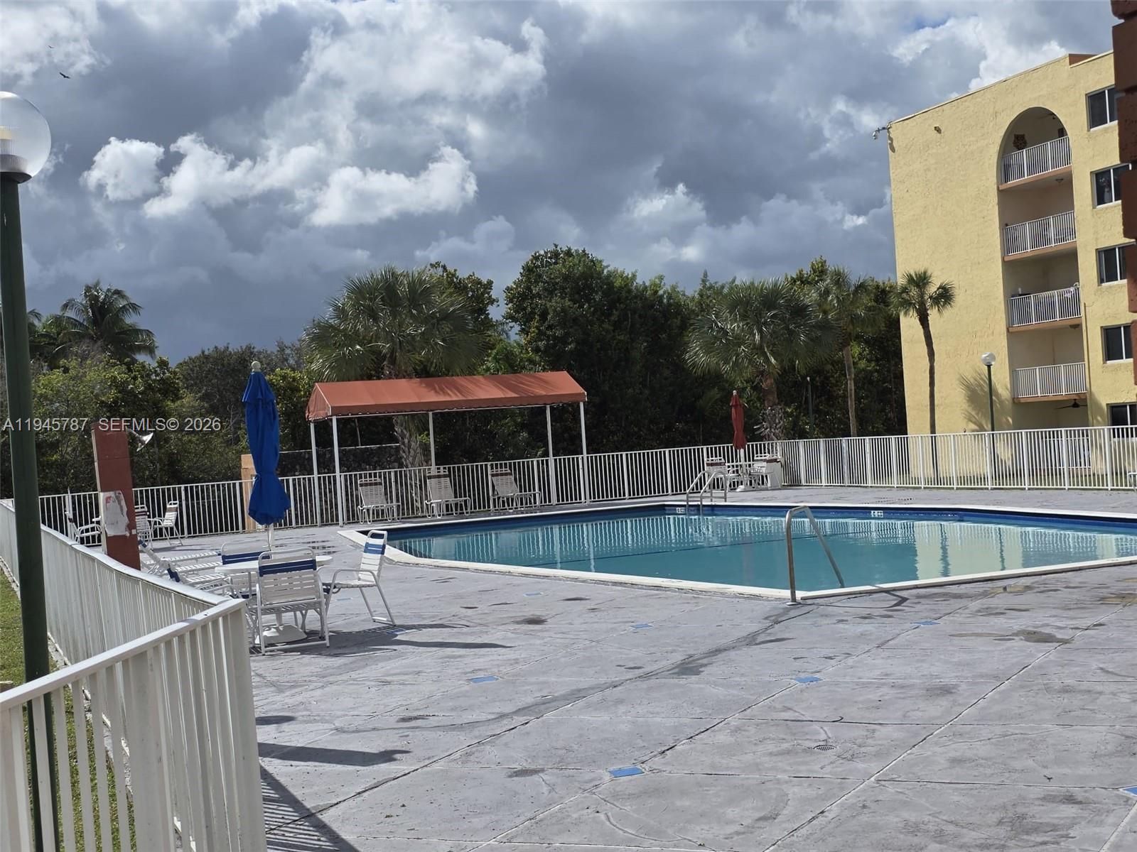 6970 Northwest 186th Street, Unit 3307 Hialeah, FL 33015 - Photo 19 of 21 a view of a house with backyard and sitting area