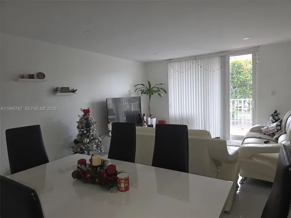 a dining room with furniture window and natural light