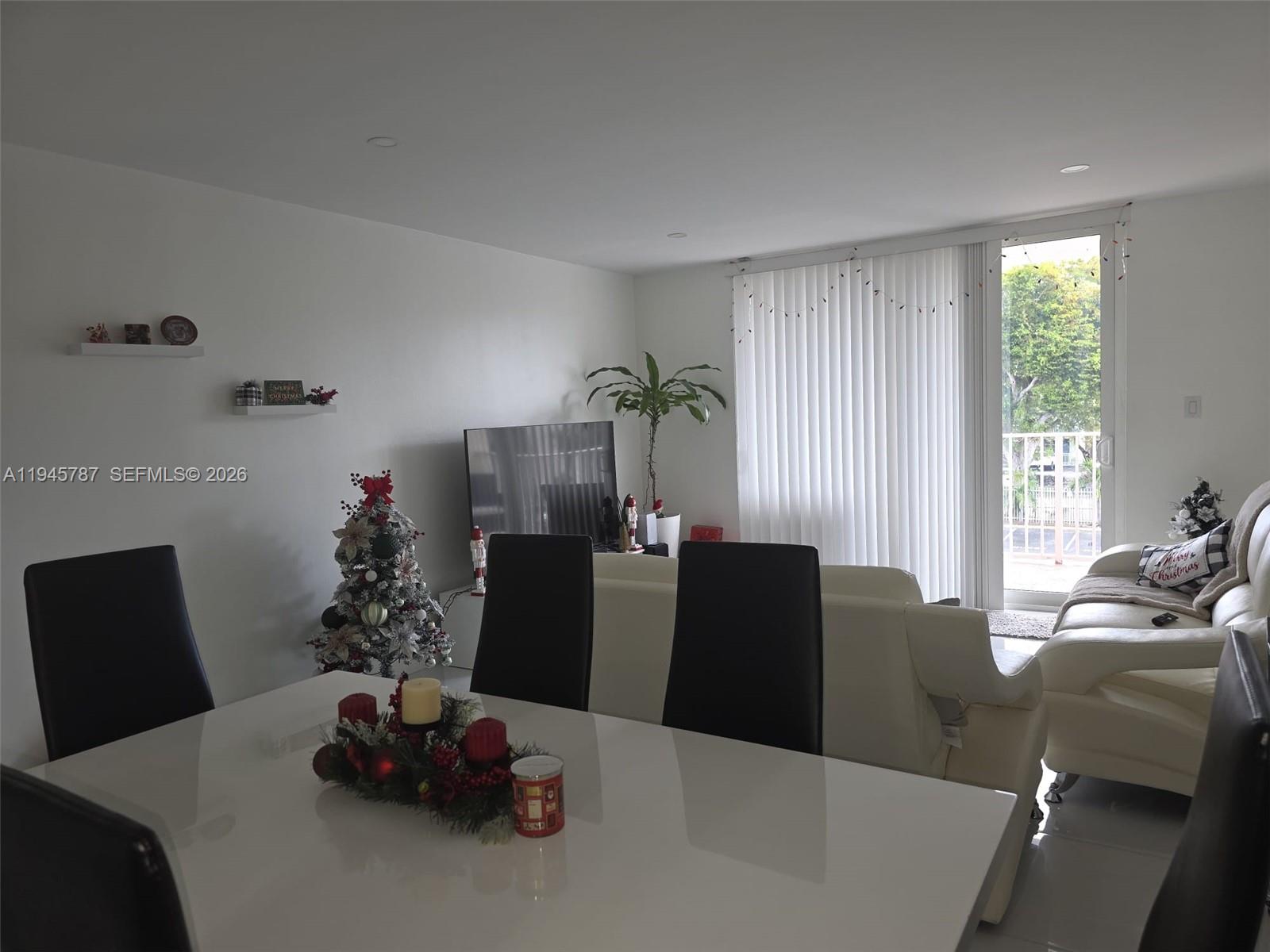 6970 Northwest 186th Street, Unit 3307 Hialeah, FL 33015 - Photo 5 of 21 a dining room with furniture window and natural light