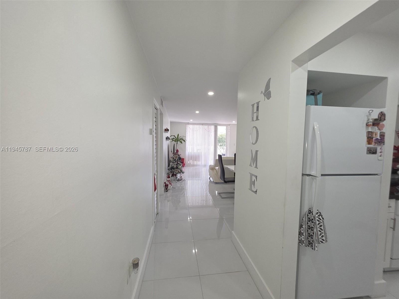 6970 Northwest 186th Street, Unit 3307 Hialeah, FL 33015 - Photo 9 of 21 a view of a kitchen with a refrigerator