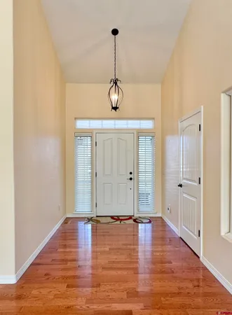 a view of room with window and wooden floor