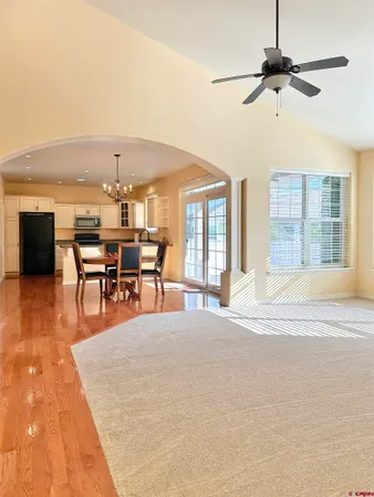 a view of a livingroom with furniture and chandelier