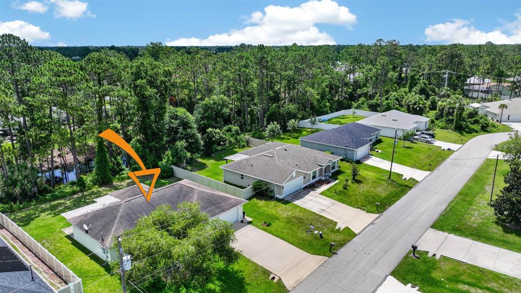 80 Roxboro Drive Palm Coast, FL 32164 - Photo 38 of 39 an aerial view of a house with garden space and street view