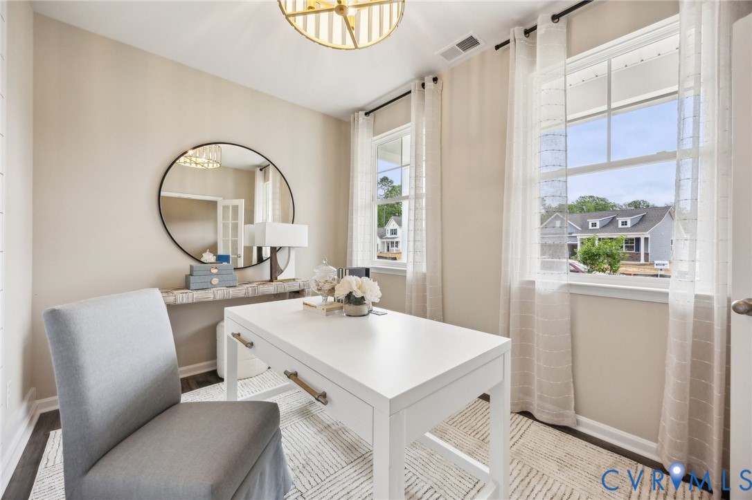 55 Liberty Lane Keswick, VA 22947 - Photo 2 of 34 a room with a table chairs and a kitchen view