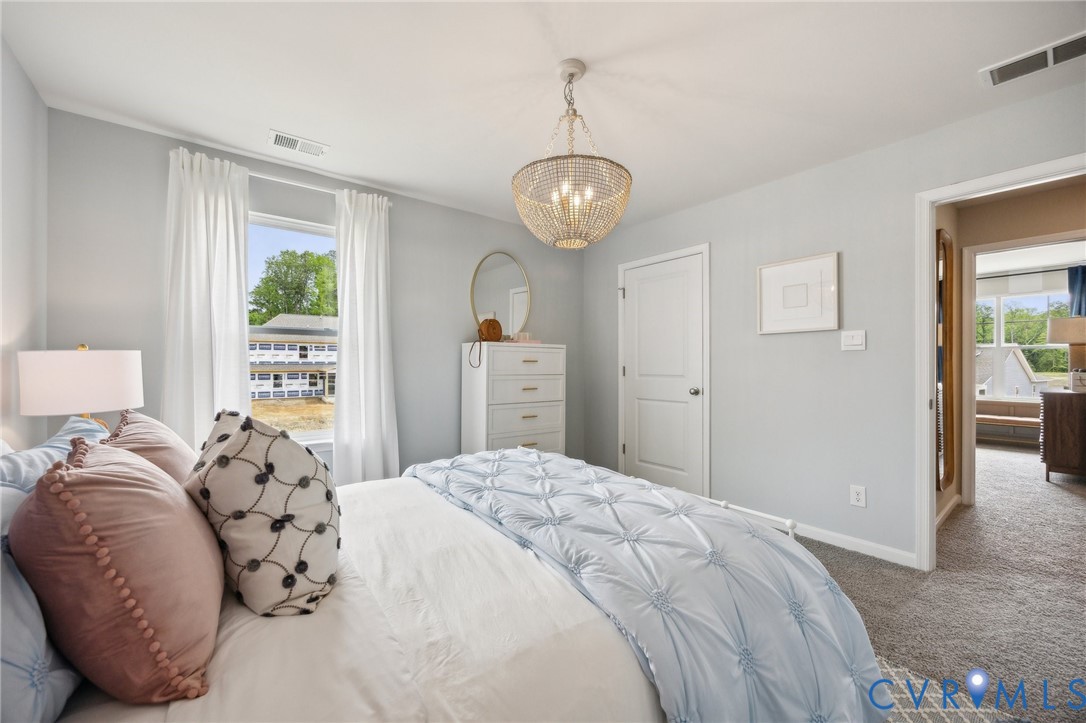 55 Liberty Lane Keswick, VA 22947 - Photo 21 of 34 a bedroom with a large bed and a window
