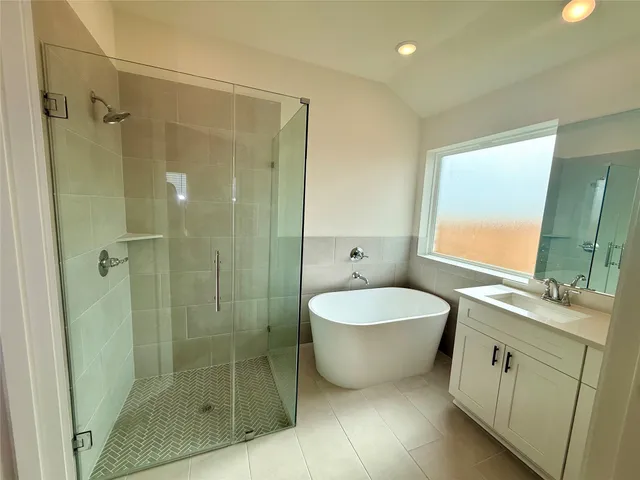 a bathroom with a double vanity sink and mirror