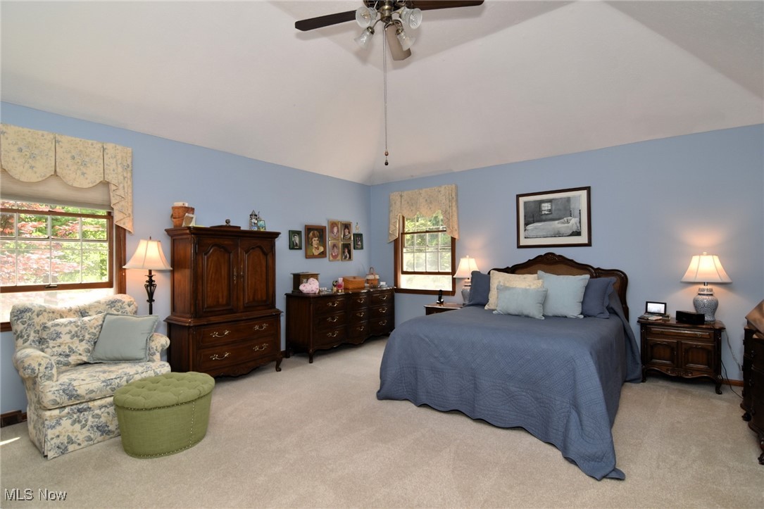 5510 Som Center Road Solon, OH 44139 - Photo 23 of 38 Carpeted bedroom with lofted ceiling, multiple windows, and a ceiling fan
