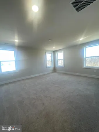 a large bathroom with a double vanity sink and a mirror