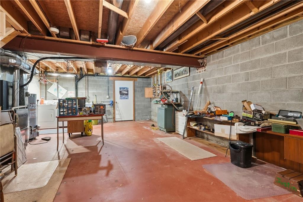 114 Sika Drive Pittsburgh, PA 15239 - Photo 36 of 45 a view of a garage with table and chairs