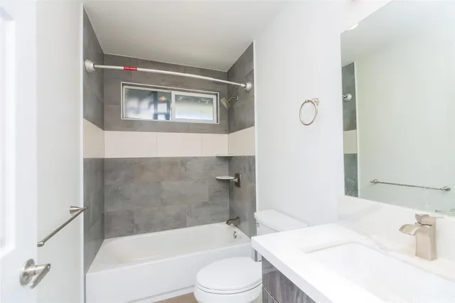 a bathroom with a sink toilet and bathtub