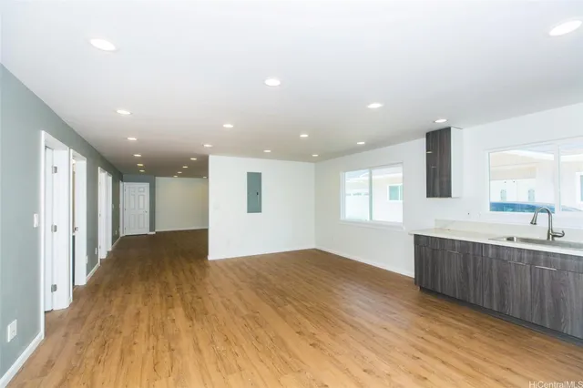 a view of kitchen with wooden floor and window