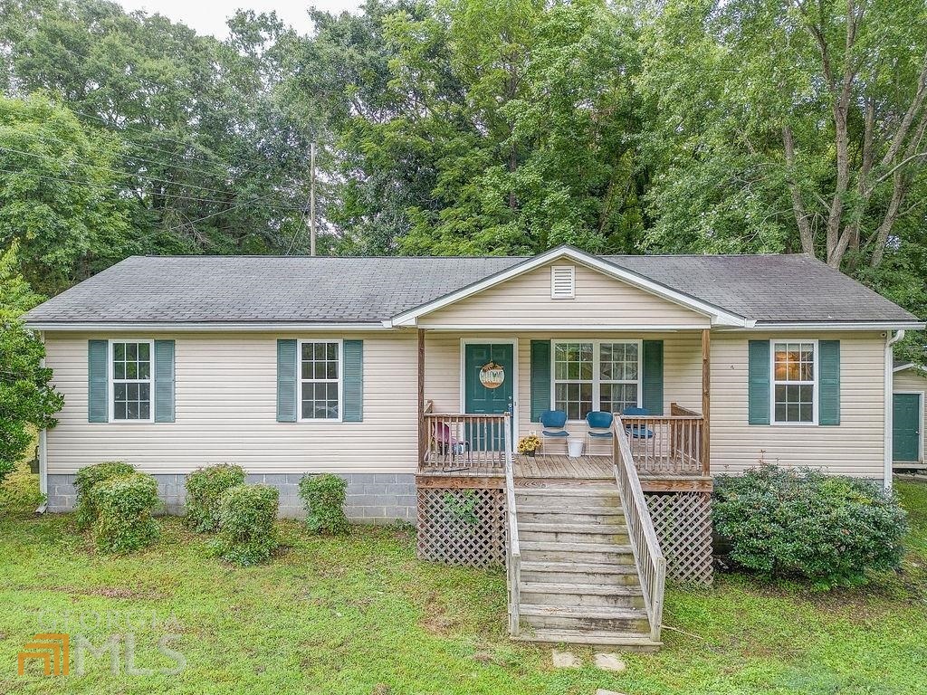 316 Woodward Street Northeast Rome, GA 30161 - Photo 1 of 1 a front view of a house with a yard