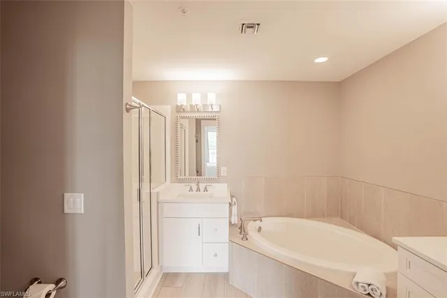 a bathroom with a bathtub and a sink