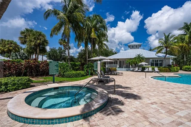 a swimming pool with outdoor seating yard and barbeque oven