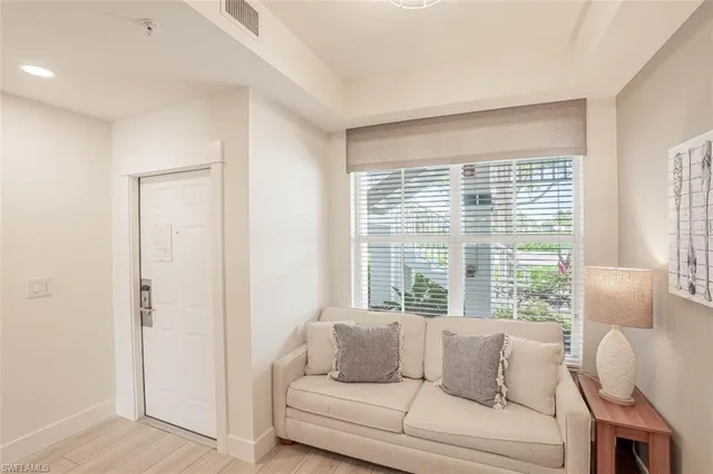 a living room with furniture and a window