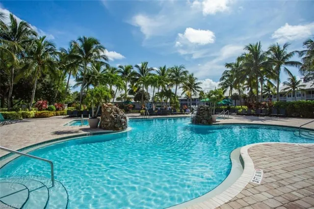 a view of a swimming pool with a patio
