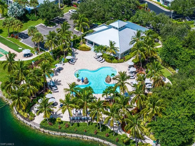 an aerial view of a house with a yard and garden