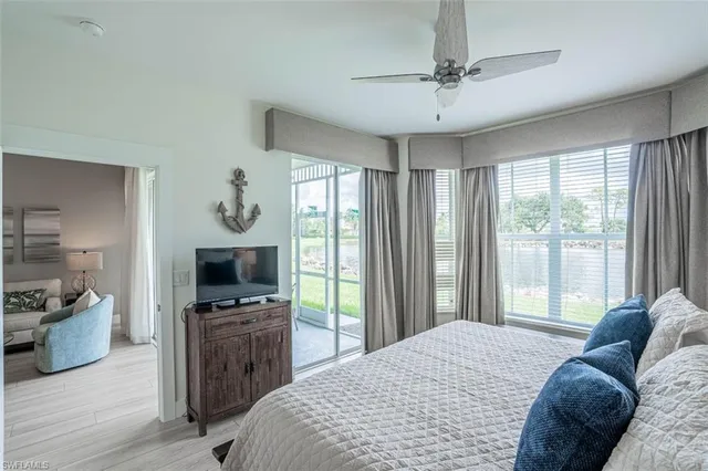 a bedroom with a bed and a television