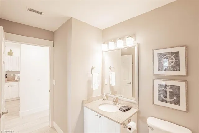 a bathroom with a double vanity sink mirror and