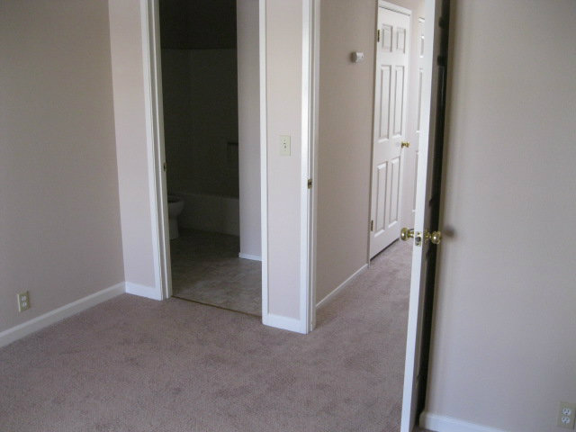 7246 Lotus Way Aptos, CA 95003 - Photo 14 of 17 a view of a hallway with closet and wooden floor
