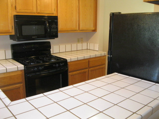 7246 Lotus Way Aptos, CA 95003 - Photo 6 of 17 a kitchen with a sink and a stove top oven