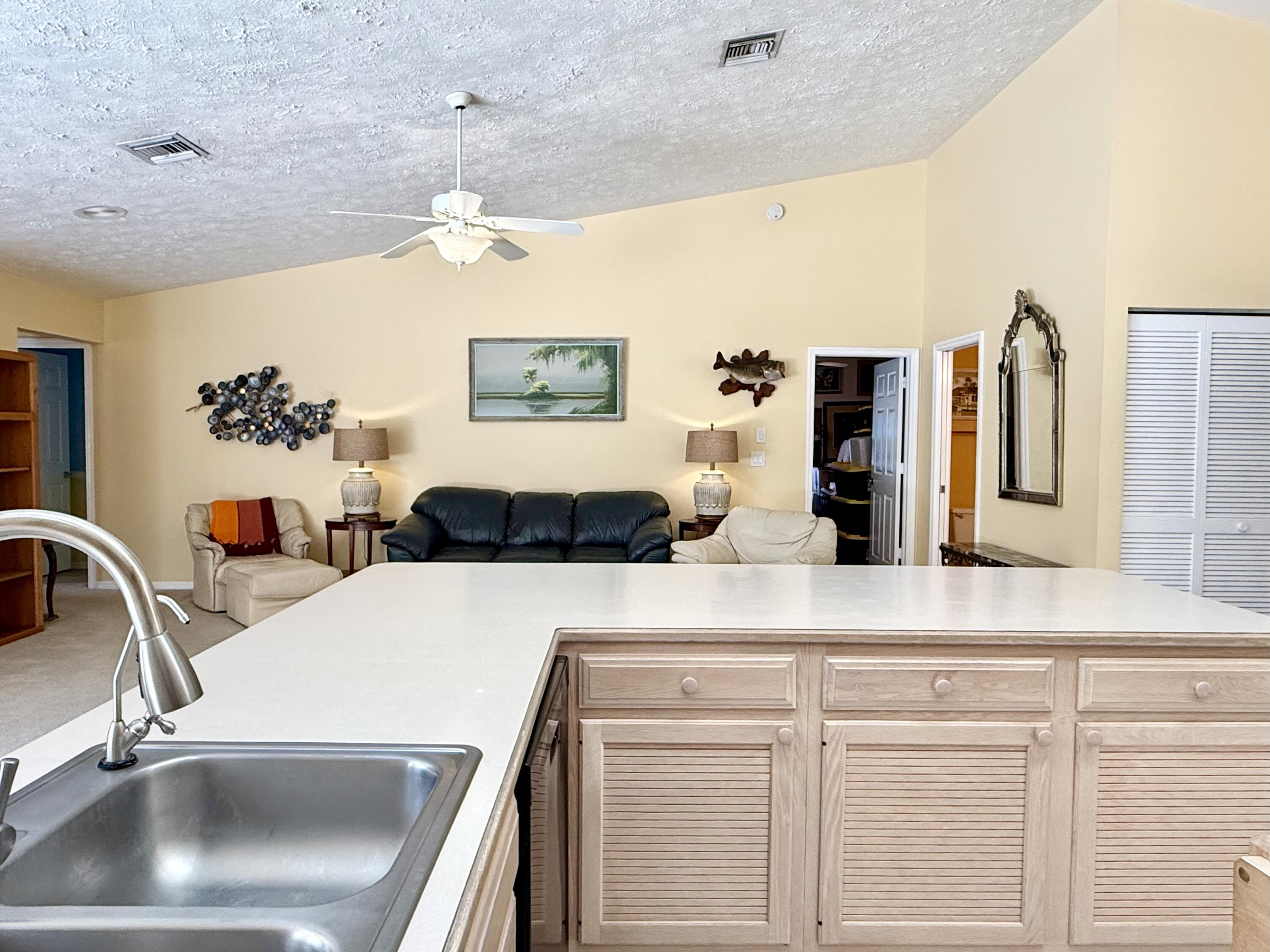 2884 Southeast Ranch Acres Circle Jupiter, FL 33478 - Photo 20 of 93 kitchen to family room