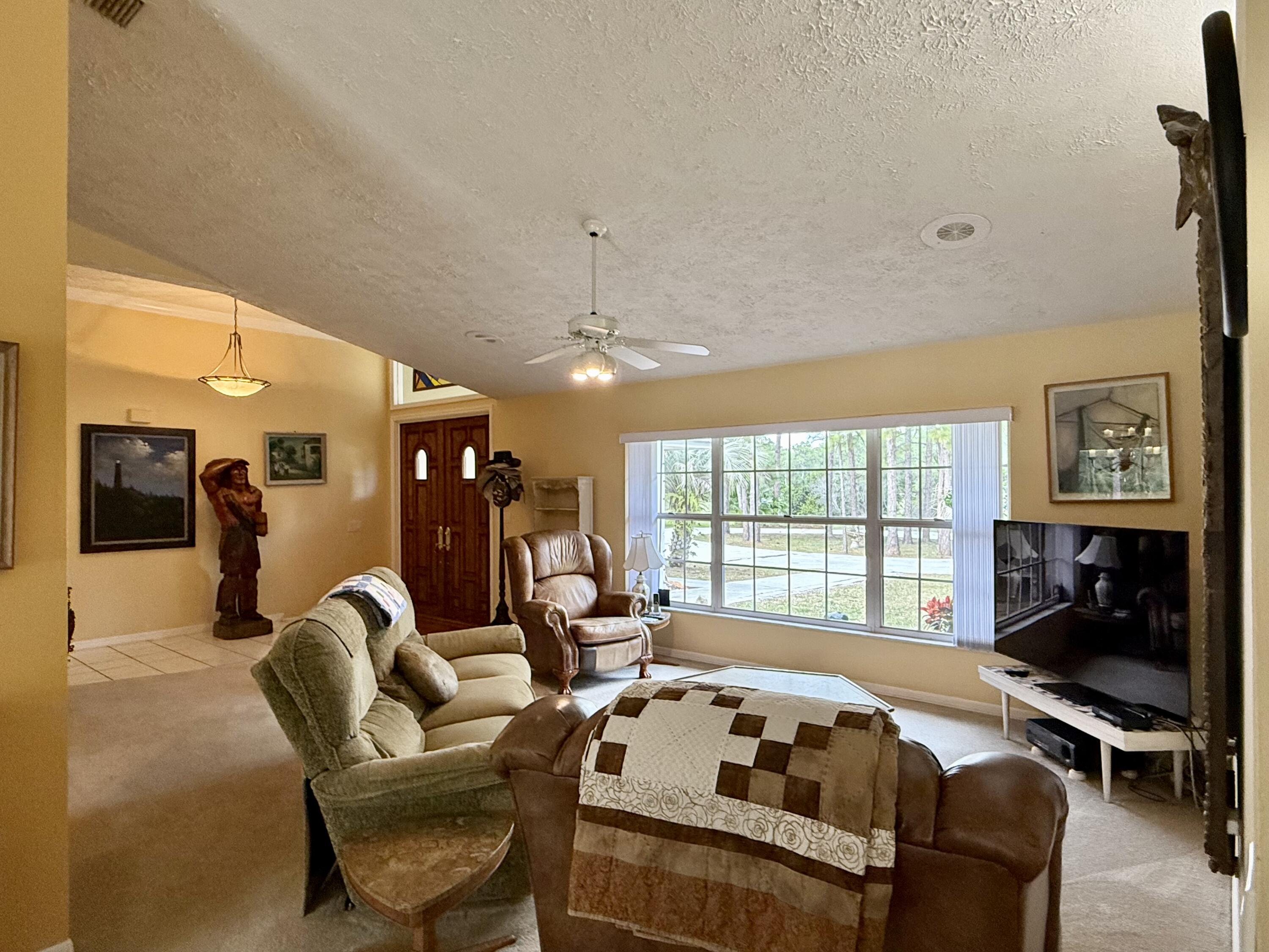 2884 Southeast Ranch Acres Circle Jupiter, FL 33478 - Photo 29 of 93 living room