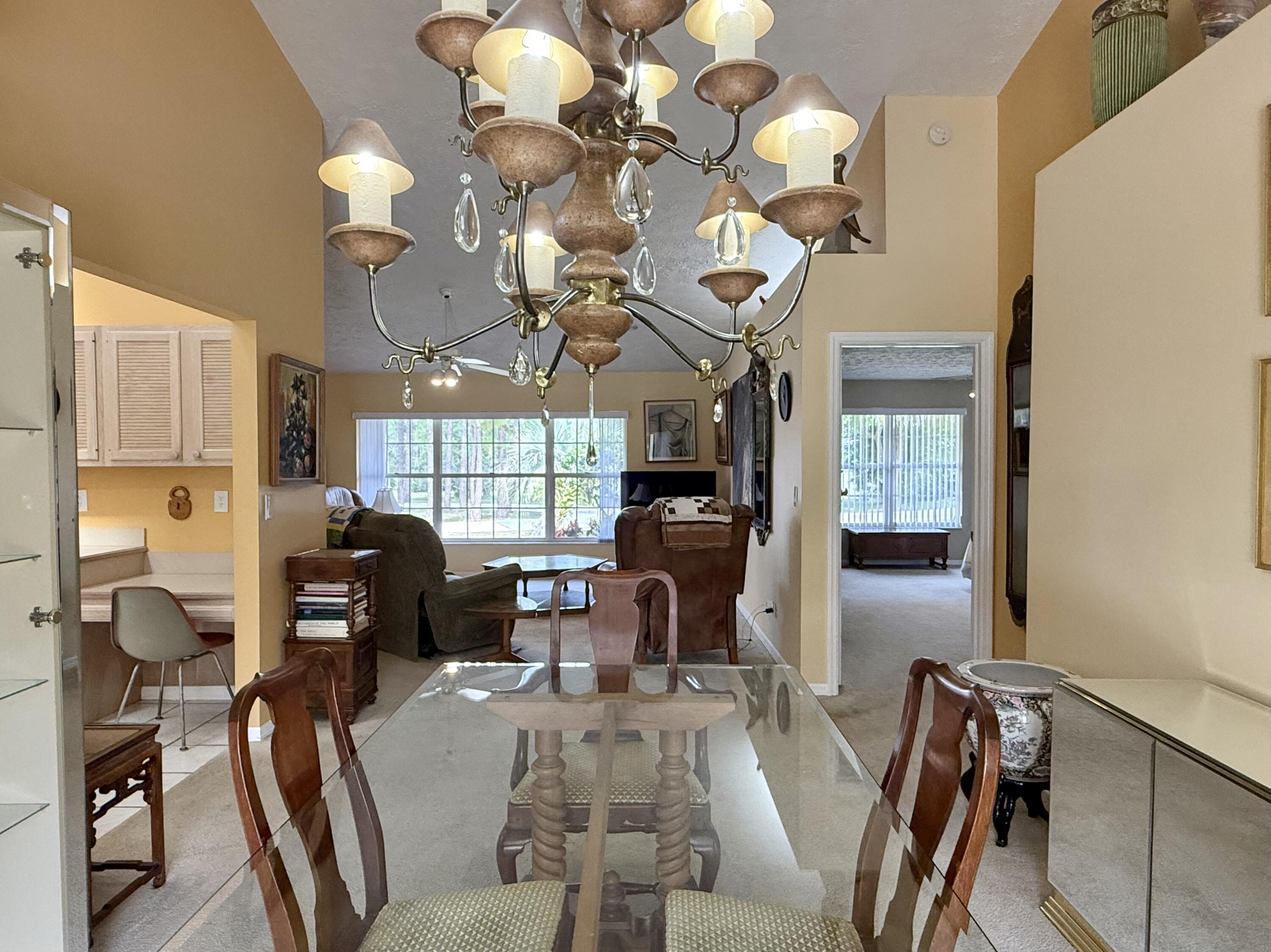 2884 Southeast Ranch Acres Circle Jupiter, FL 33478 - Photo 35 of 93 dining room to living room