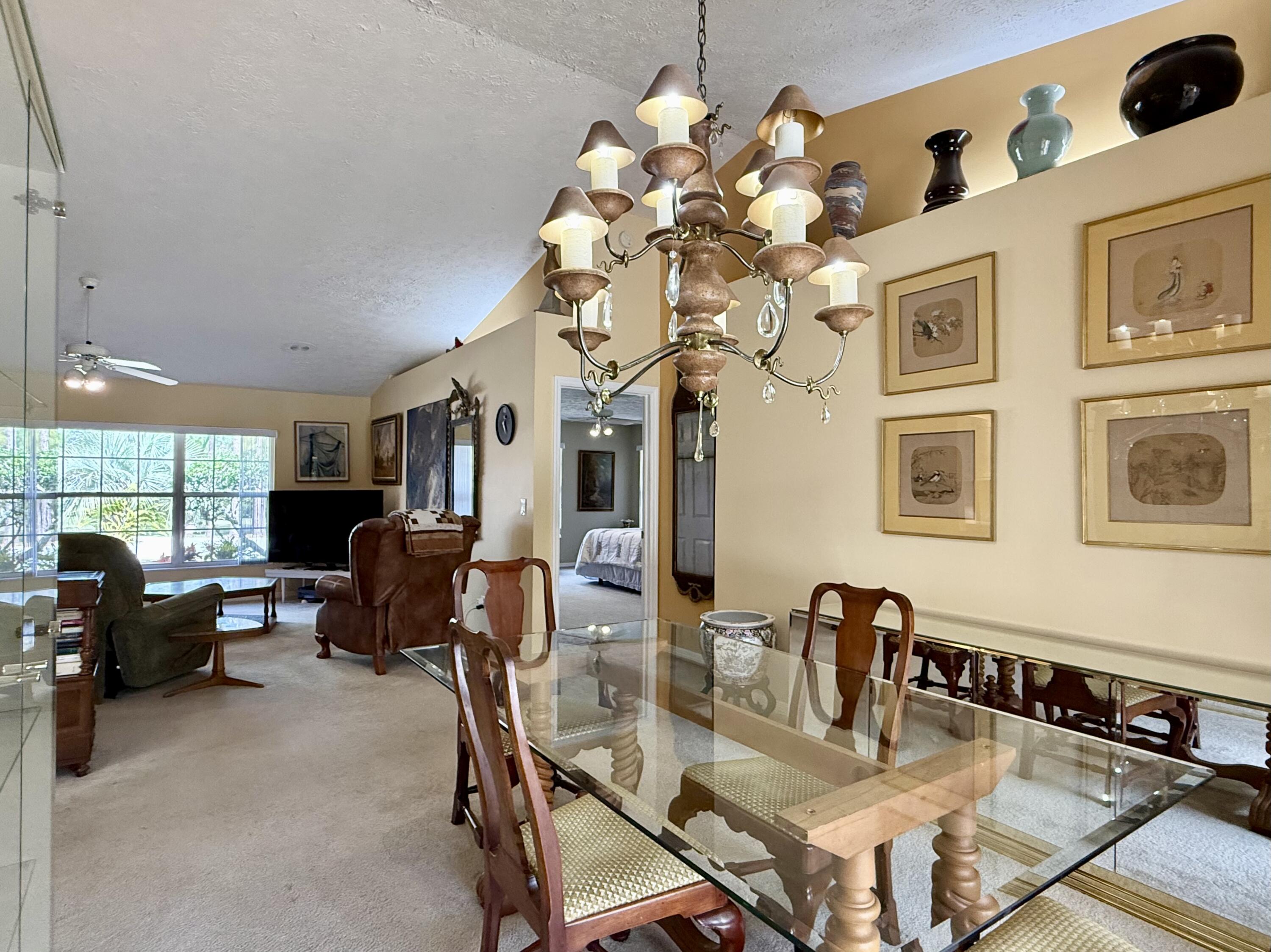 2884 Southeast Ranch Acres Circle Jupiter, FL 33478 - Photo 37 of 93 dining room to living room