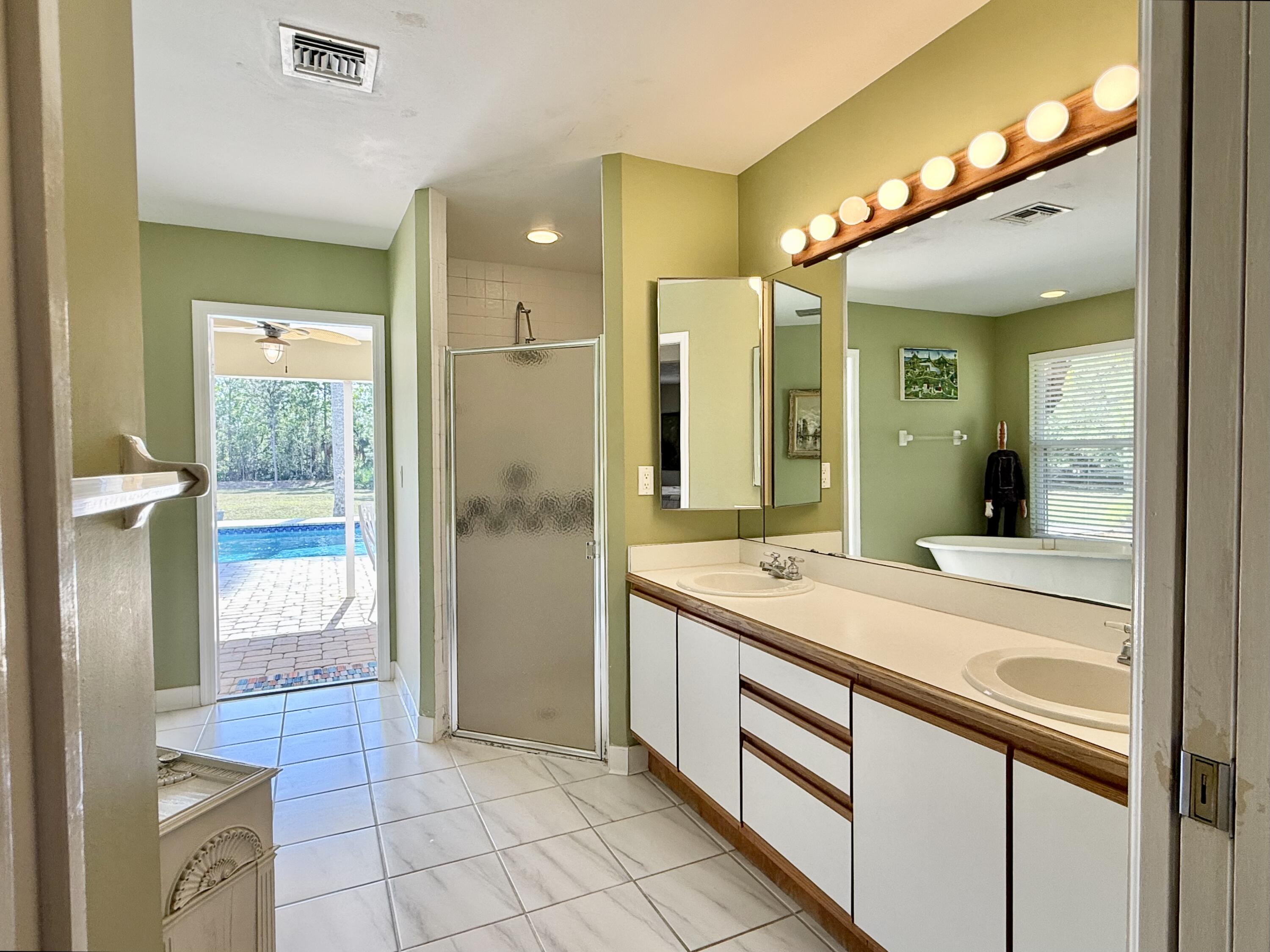 2884 Southeast Ranch Acres Circle Jupiter, FL 33478 - Photo 49 of 93 bathroom 1